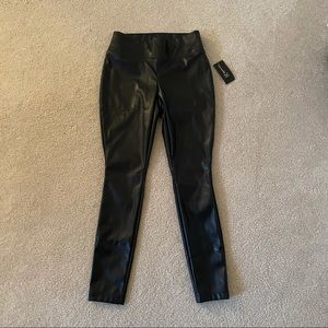 Never worn before petite black leather pants.